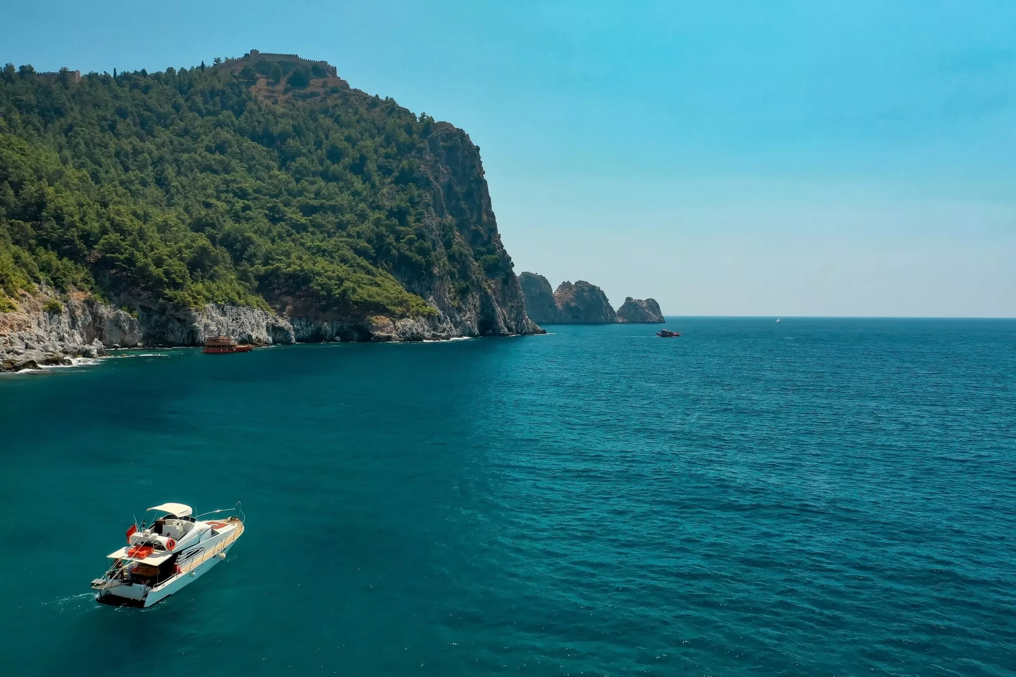 sailboat-in-the-sea-in-the-evening-sunlight-over-beautiful-big-mountains-luxury-summer-adventure-active-vacation-in-mediterranean-sea-turkey.jpg